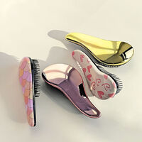 Mini brosse démélante doré